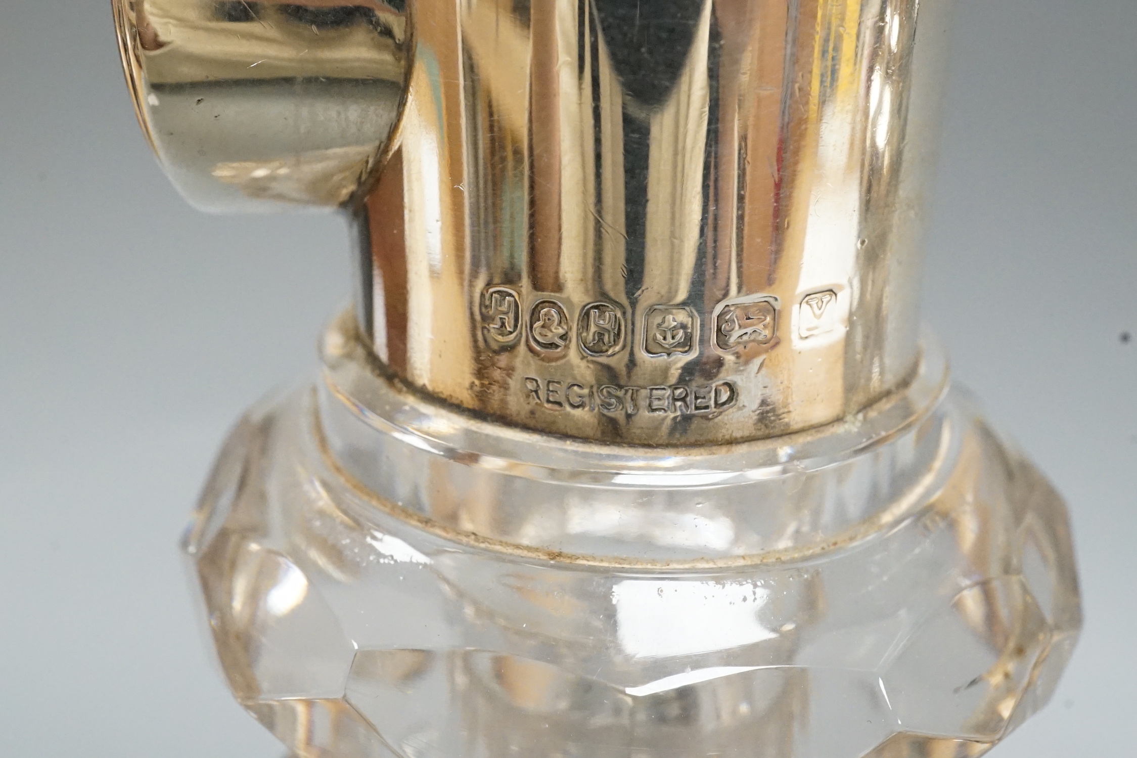 A near pair of George V silver mounted cut glass decanters and stoppers, by Hukin & Heath, Birmingham, 1922, approx. 30.7cm.